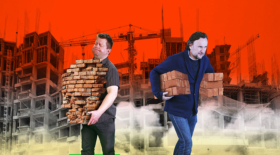 File picture shows workers walking in front of the construction site of a commercial complex on the outskirts of Ahmedabad